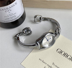 Reloj de pulsera con correa de acero y esfera artística retro de Niche para mujer