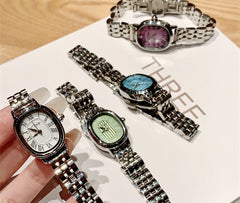 Reloj de acero con escala romana de nicho para mujer