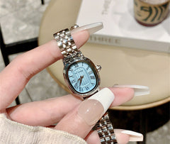 Reloj de acero con escala romana de nicho para mujer