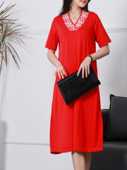 Elegante vestido midi de lino de punto con cuello en V y manga corta