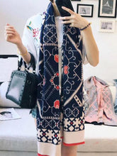 Bufanda de lana con monograma en bloques de color