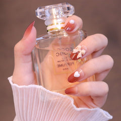 Uñas postizas ombré rojas redondeadas medianas con lazo y corazón