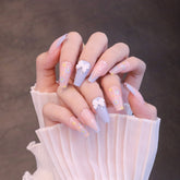 Uñas postizas largas cuadradas rosas y moradas con lazo