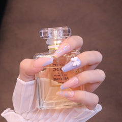 Uñas postizas largas cuadradas rosas y moradas con lazo