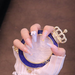 Uñas postizas largas cuadradas rosas y moradas con lazo