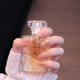 Uñas postizas cuadradas medianas color nude con lazo y perla