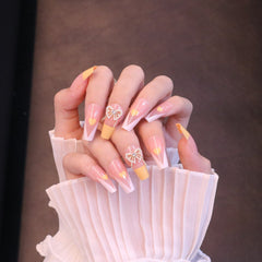 Uñas francesas amarillas cuadradas largas con lazo