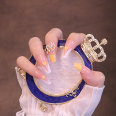 Uñas francesas amarillas cuadradas largas con lazo