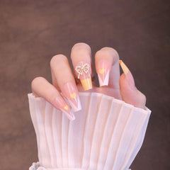 Uñas francesas amarillas cuadradas largas con lazo