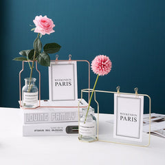 Jarrón de hierro con tubo de ensayo de vidrio y pinza