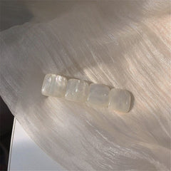 Pinza para el cabello con piedra iridiscente blanca