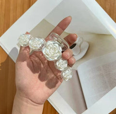 Pinza para el cabello transparente con rosa blanca