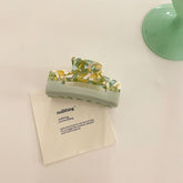 Pinza para el pelo acrílica pequeña con confeti marmolado