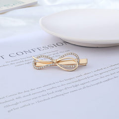 Horquilla con lazo redondo adornada con cristales