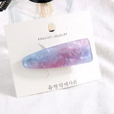 Glitzernde und marmorierte Haarspangen