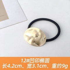 Goldene elastische Haargummimanschetten