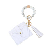 Pulsera billetera con llavero y borla