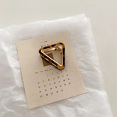 Mini pinza para el pelo triangular hueca