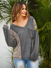 Suéter acogedor con cuello en V y bloques de color