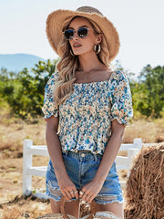 Top de margaritas con mangas abullonadas y fruncido