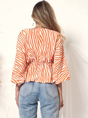 Blusa de manga larga con botones y estampado de cebra