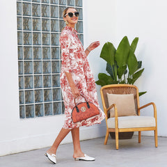 Kleid mit Vintage-Print und gestuftem Saum