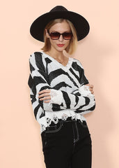 Pullover mit Zebramuster und ausgefranstem Saum
