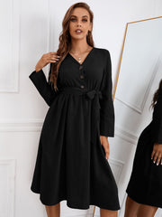 Vestido con cinturón de color liso