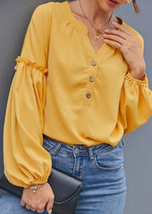Blusa con mangas de obispo y medio botón al frente
