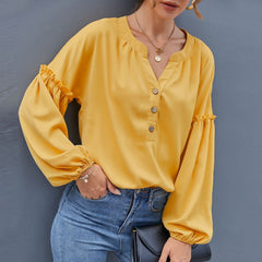 Blusa con mangas de obispo y medio botón al frente