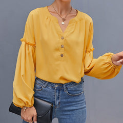 Blusa con mangas de obispo y medio botón al frente