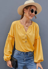 Blusa con mangas de obispo y medio botón al frente
