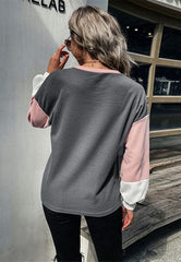 Suéter con bloques de colores geométricos