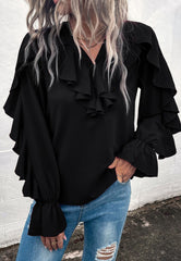 Blusa vintage con detalle de volante y cuello en V