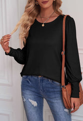 Blusa con puños abotonados de color liso