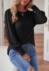 Blusa con puños abotonados de color liso