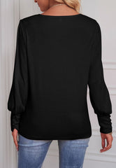 Blusa con puños abotonados de color liso