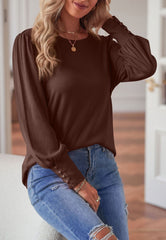 Blusa con puños abotonados de color liso