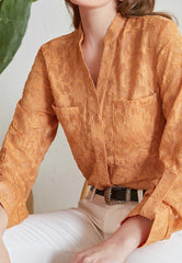 Blusa túnica con botones de encaje