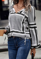 Blusa con mangas de obispo y estampado geométrico