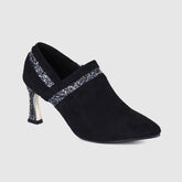 Botas Chelsea brillantes con punta y boca poco profunda