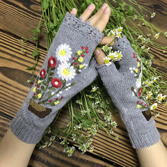 Guantes de punto largos y cálidos con pequeñas flores rojas en maceta