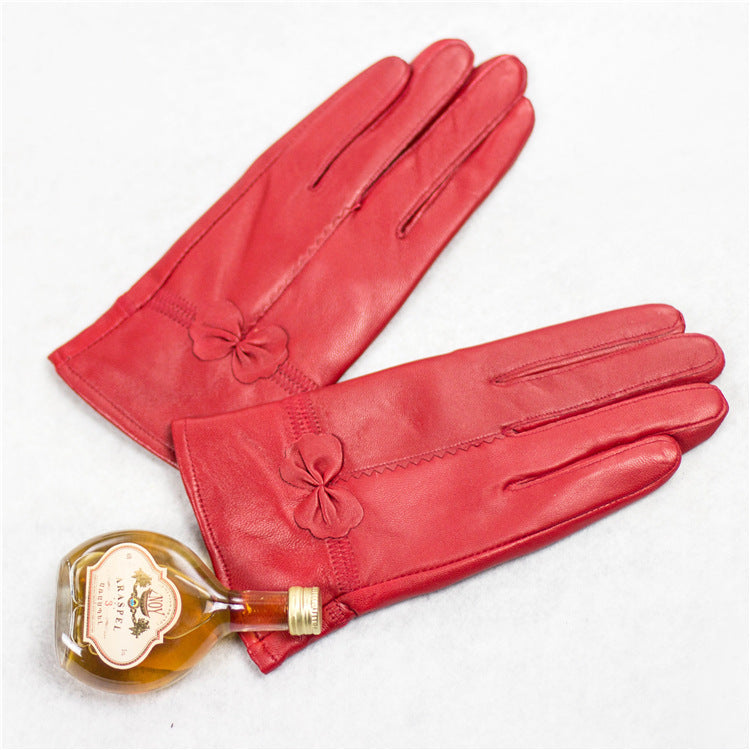 Guantes de piel de oveja para otoño e invierno para mujer, con lazo rojo frío, cálidos y de terciopelo.