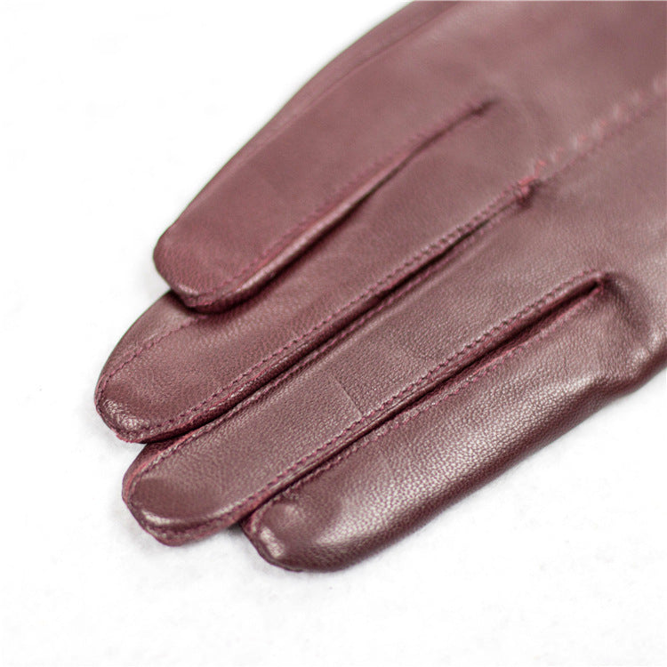 Guantes de piel de oveja para otoño e invierno para mujer, con lazo rojo frío, cálidos y de terciopelo.