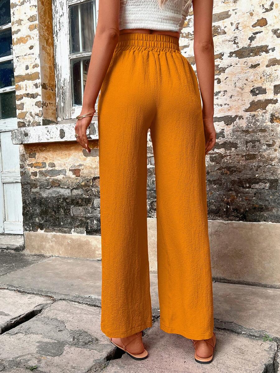 Pantalones anchos con bolsillos inclinados de color liso 