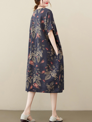 Kurzes, ausgestelltes Kleid mit Puffärmeln und gesmokten Taillen