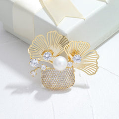 Broche de bolsita con relleno de plantas, cristales y perla