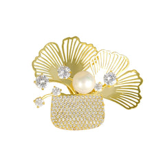 Broche de bolsita con relleno de plantas, cristales y perla