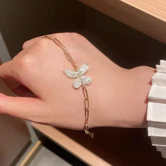 Pulsera de cadena de oro con mariposa de cristal