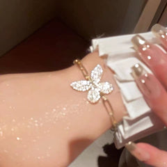 Pulsera de cadena de oro con mariposa de cristal